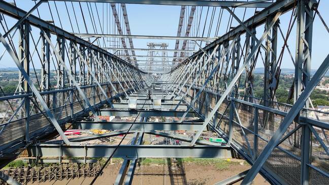 View across the high level truss along which the traveller moves. Foot traffic used the walkways on either side